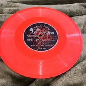 From Walt Disney‘s official Mickey Mouse Club, Huckleberry Finn orange vinyl